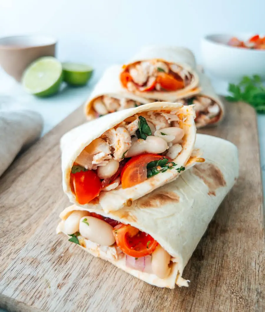 Chicken with marinated tomato and white bean salad wrap