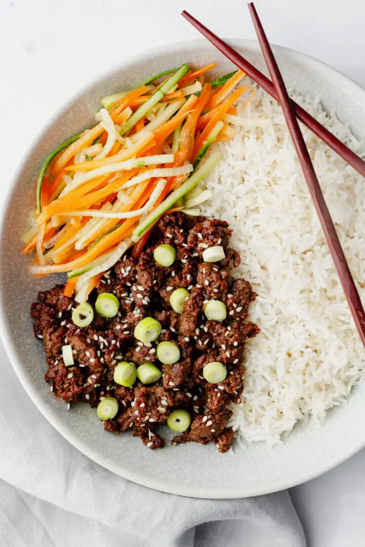 Hoisin Beef Bowl with rice and carrot cucumber salad