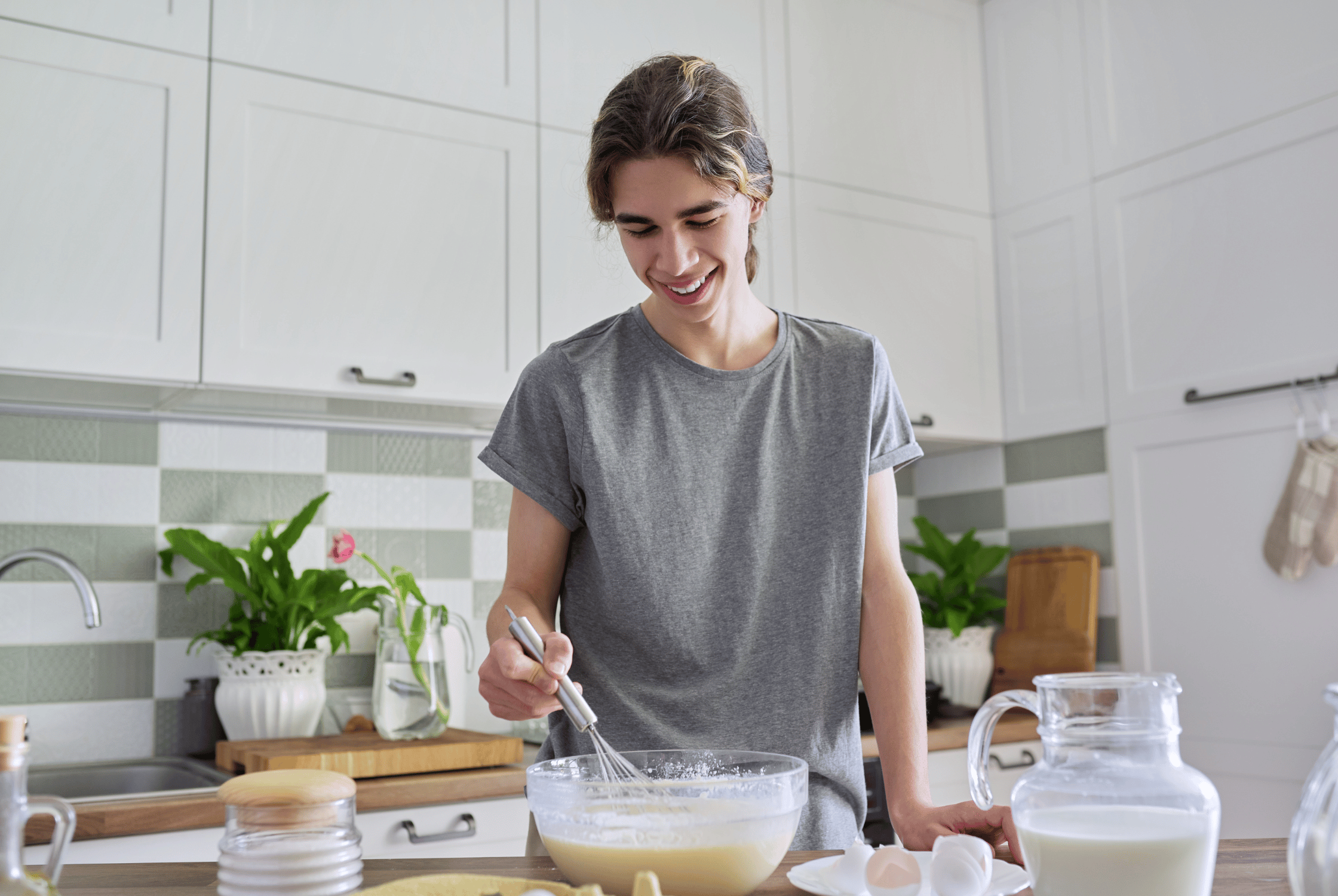 Teenager cooking family meals