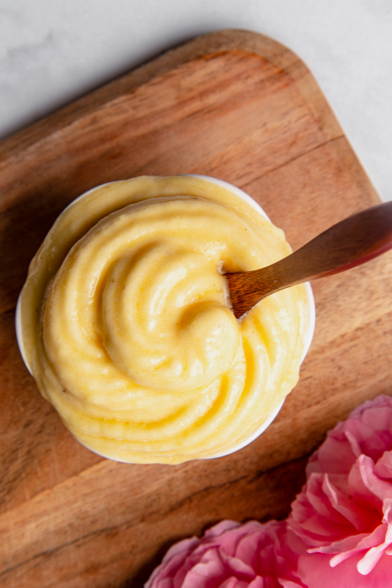Healthy Tropical Soft Serve in a bowl with a spoon
