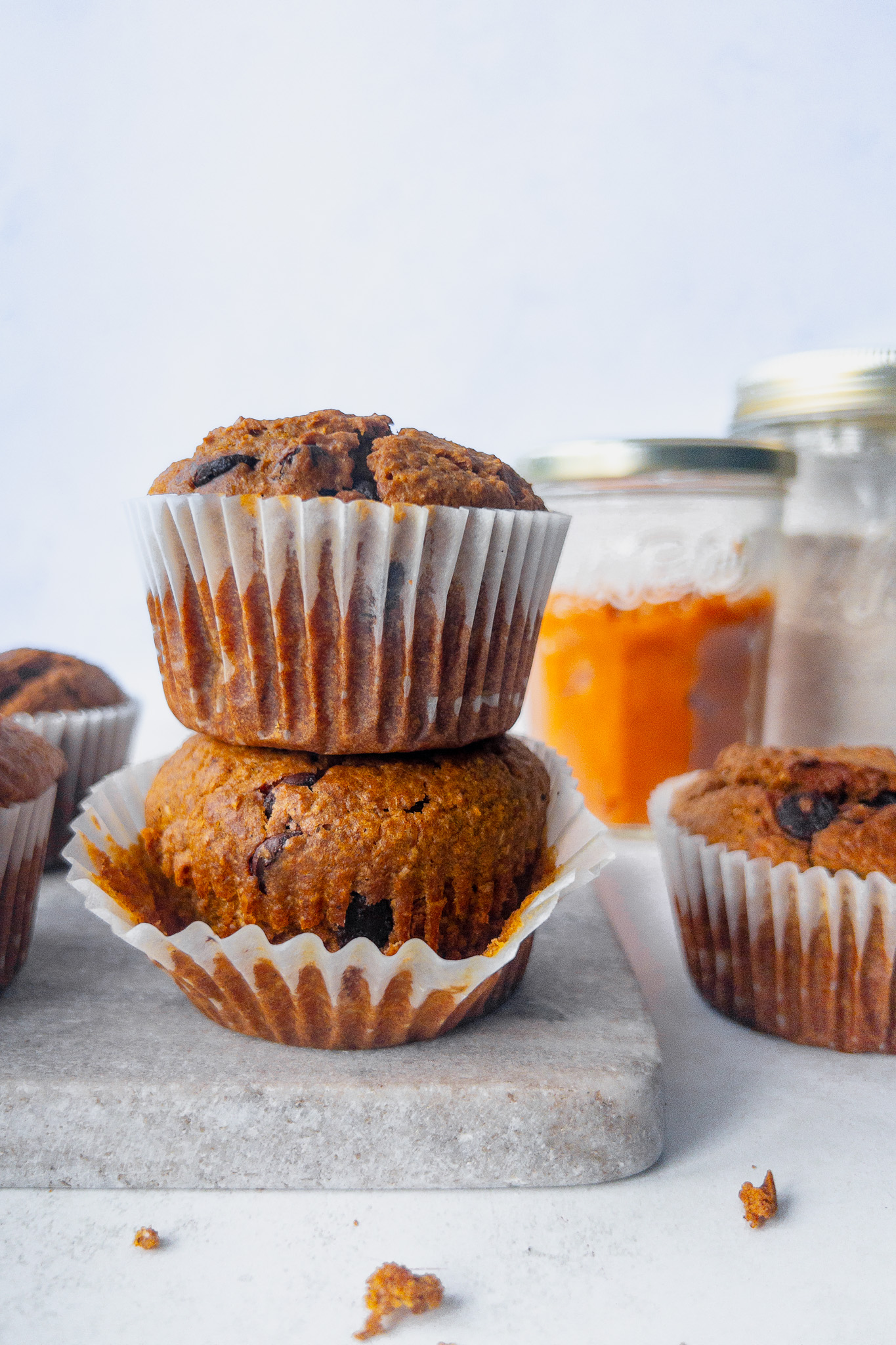 Pumpkin Spice Breakfast Muffins with chocolate chips in muffin cases