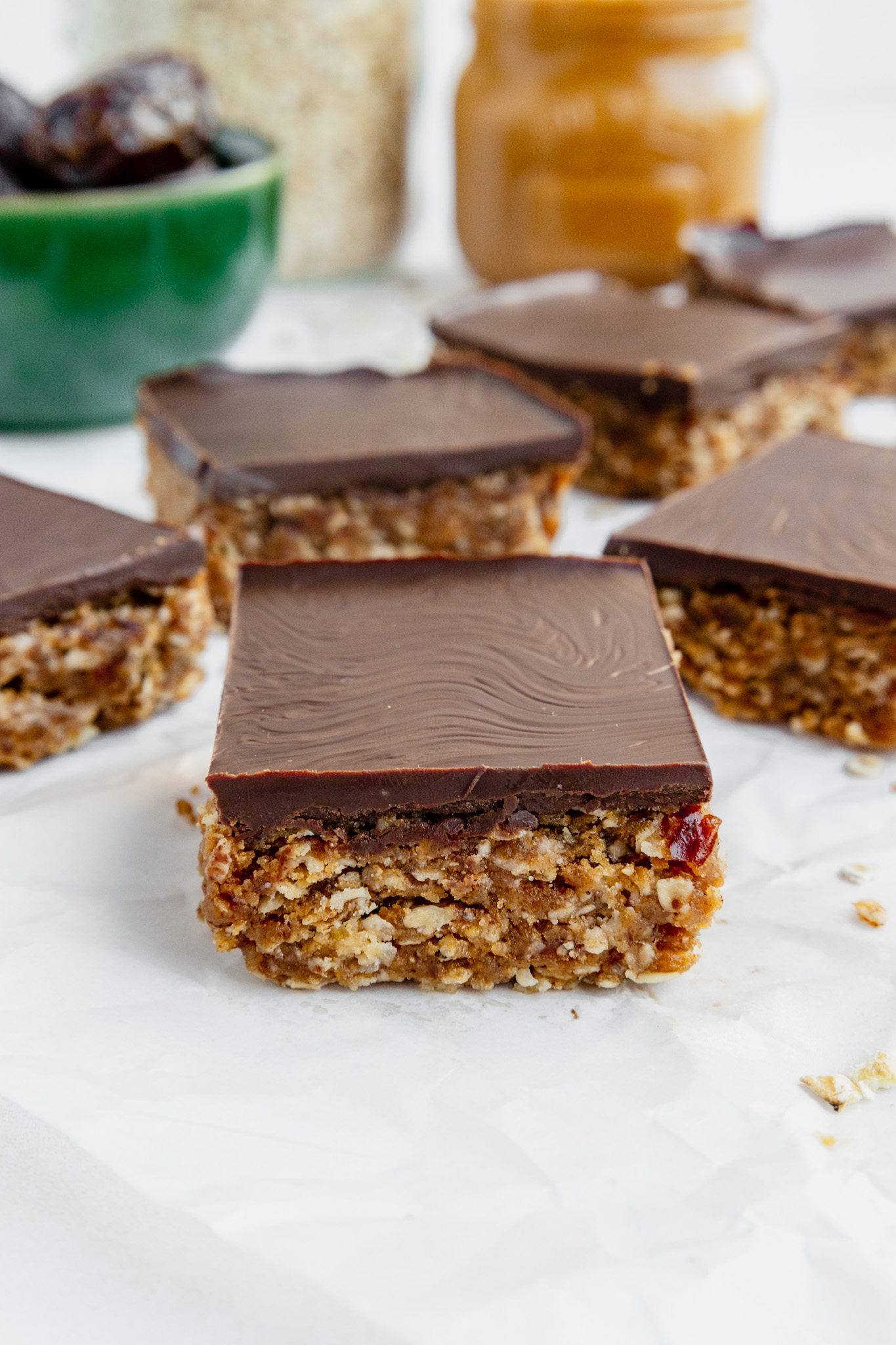 peanut butter date oat bars with chocolate topping