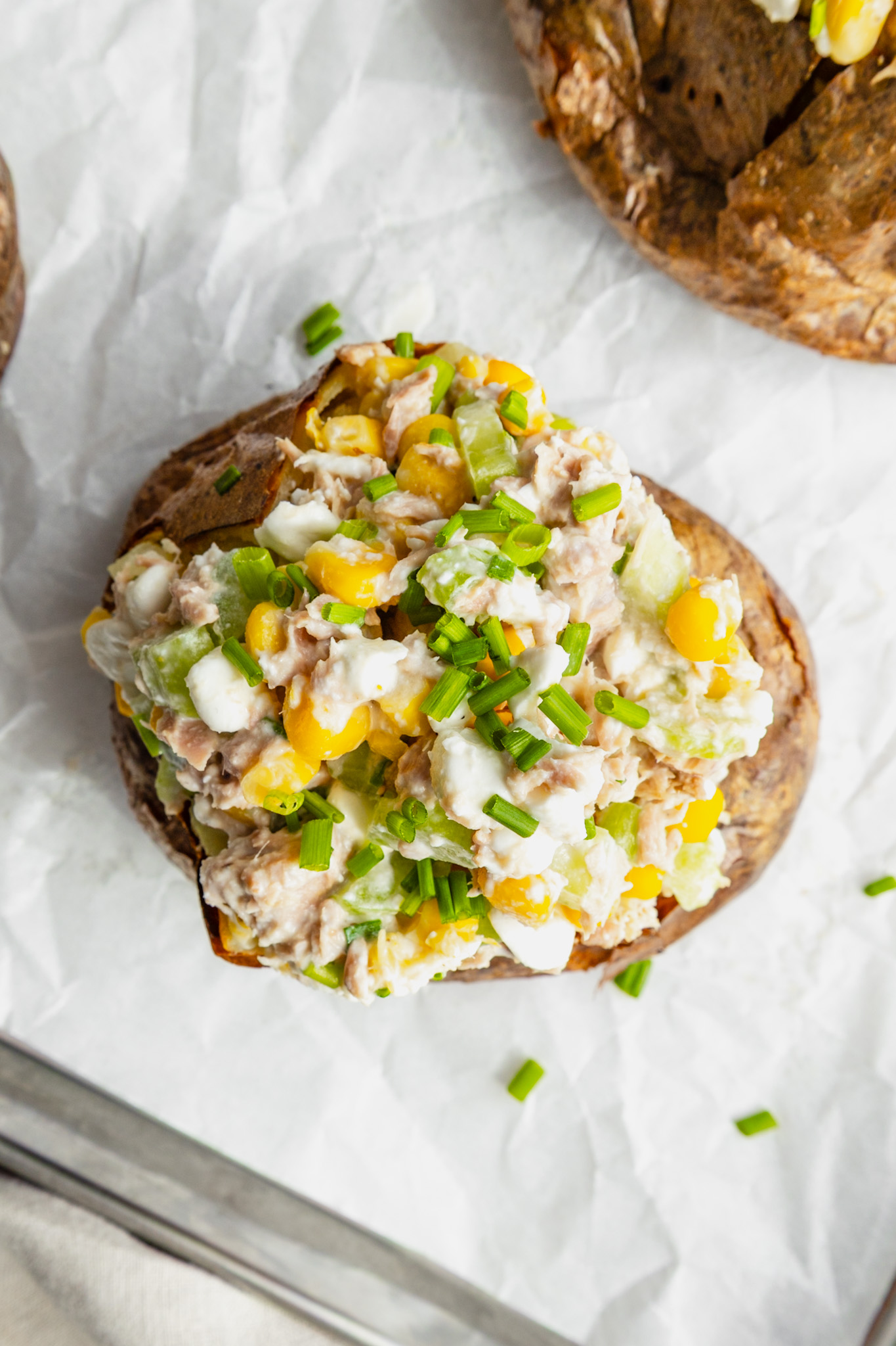 Jacket potato topped with tuna, sweetcorn cottage cheese, celery salad