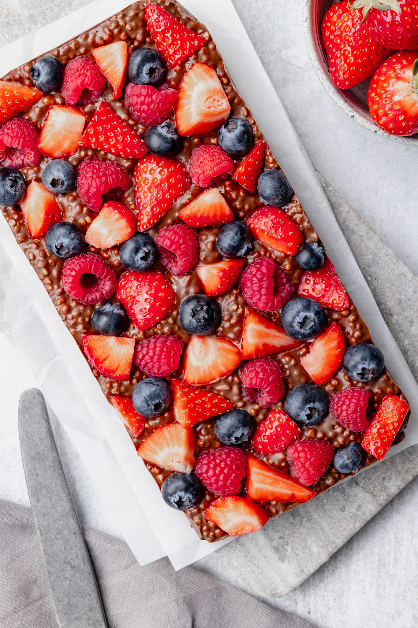 Berry Chocolate Bar with strawberries, blueberries and raspberries, peanut butter, and puffed quinoa