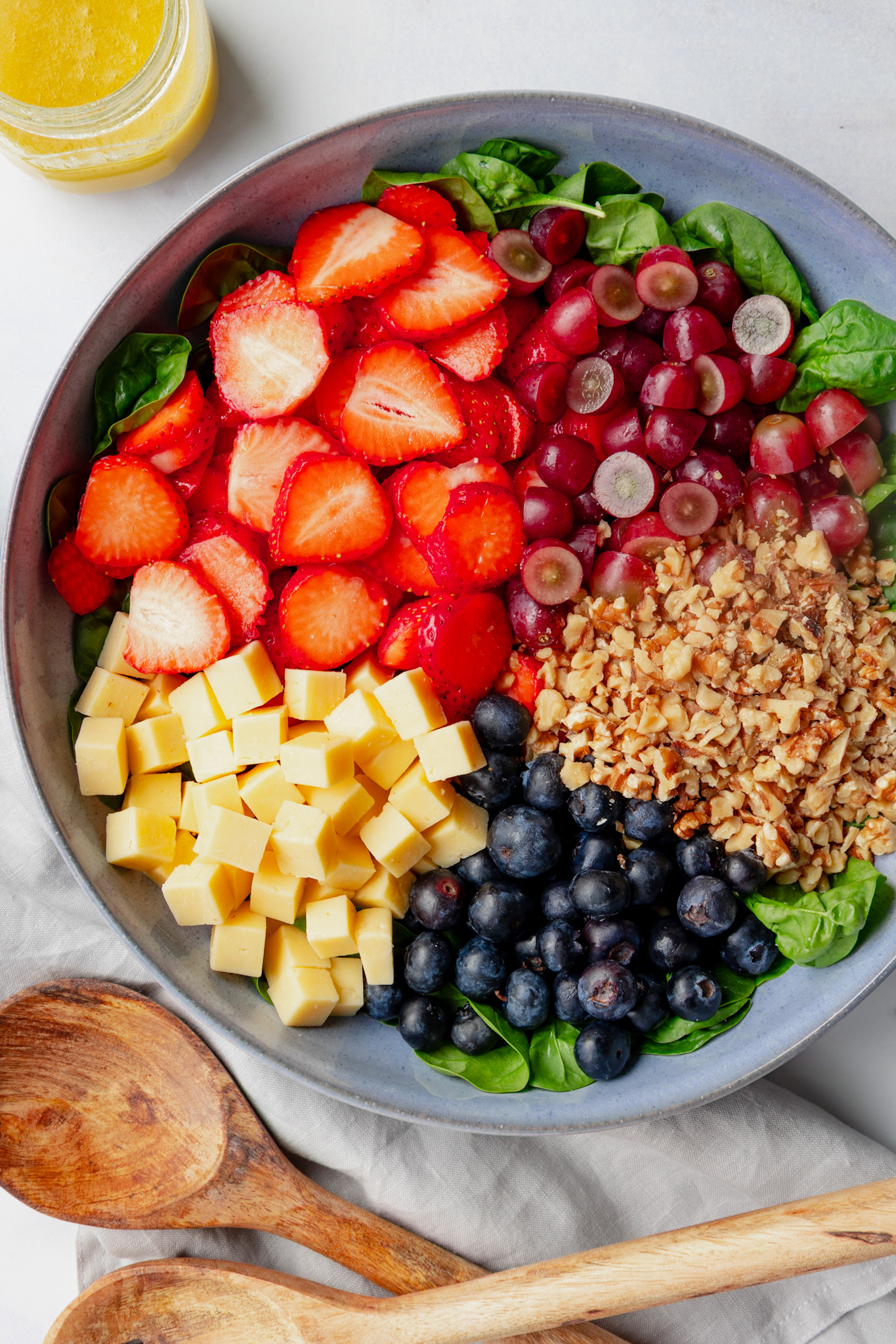 Spinach and Fruit Salad with strawberries blueberries and grapes