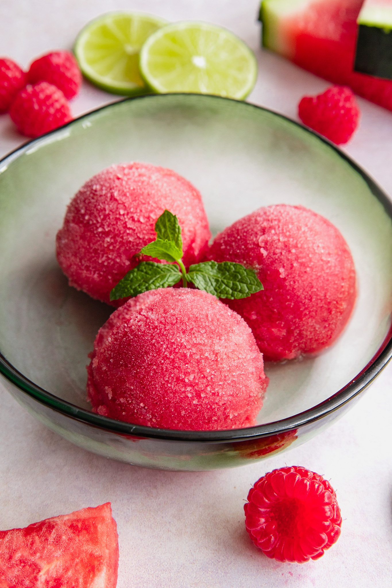 Watermelon Raspberry Sorbet topped with a mint sprig