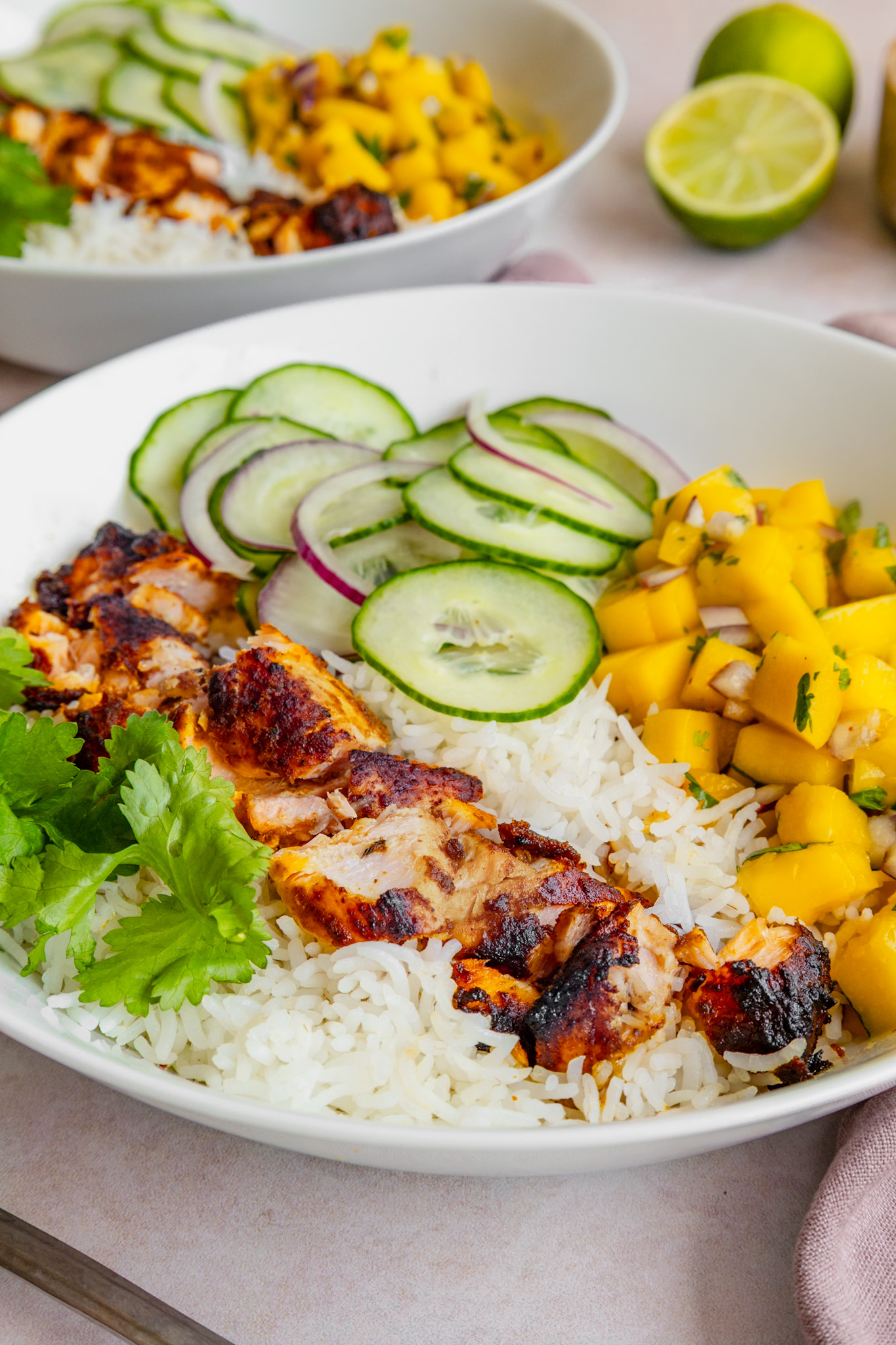 Curried Salmon Bowls with cucumber salad and mango salsa