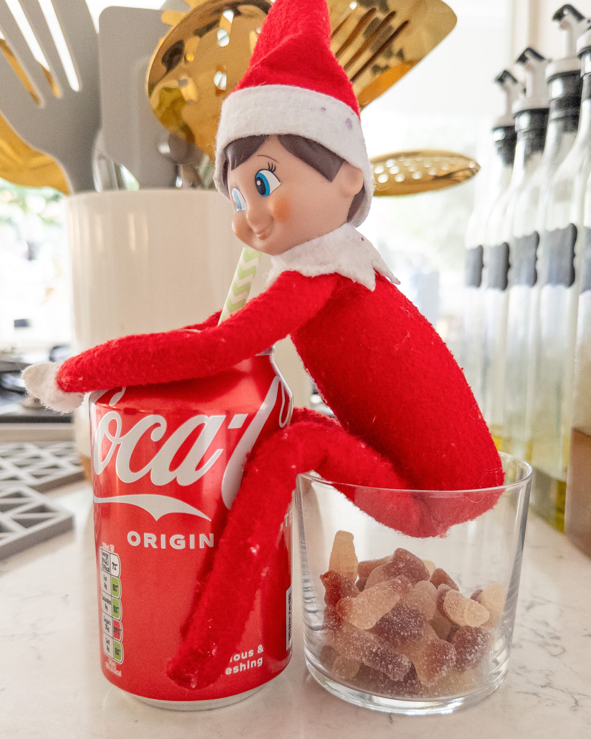 Elf turns coca cola into cola bottles